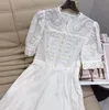 Robe femme Marque de mode européenne Coton blanc brodé pendentif perle creuse avec manches bouffantes taille froncée robe midi