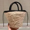 2024SS Sac de plage seau à nœud papillon à la mode pour femmes, fourre-tout en Crochet ajouré, panier de légumes tissé en paille fait à la main, sac de vacances d'été avec cordon de serrage, petit sac