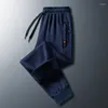 Pantaloni da uomo Autunno Inverno Floccaggio Solido Elastico Tasche a vita alta Cerniera Forma geometrica Pantaloni sportivi larghi casual Moda