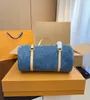 Explosion Womens NEW Papillon M46830 Denim Blue Denim canvas Gold-color hardware Zip closure Mini zipped version Chain jacquard Luxury designer Antiqu counter