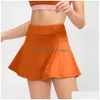 Yoga Outfit Ll-007 Gonne da tennis Gonna a pieghe Abbigliamento da palestra Donna Corsa Fitness Pantaloni da golf Pantaloncini Sport Tasca posteriore in vita Cerniera D Dhzoj