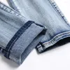 Jeans da uomo Designer uomo con ricamo serpente Fori strappati Pantaloni in denim elasticizzato blu Pantaloni affusolati slim