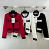 2024 Blanco/Negro/Rosa de manga corta 100% suéteres de lana para mujer botones de diseñador bolsillos cárdigans para mujer dh22213