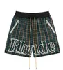 Trendy Rhude Letter Casual Sports Mesh rutiga shorts för män och kvinnor High Street Elastic Beach Pants