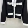 2024 Blanco/Negro/Rosa de manga corta 100% suéteres de lana para mujer botones de diseñador bolsillos cárdigans para mujer dh22213