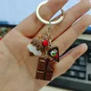 Keychains Lovely Dessert Keychain Resin Simulation Chocolate Cream Label Key Ring Mini Handbag Pendant Girl Gift Jewelry Accessories