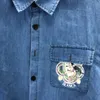 Nouvelle chemise à manches courtes en denim du créateur printemps/été 2024, en tissu denim pur coton haut de gamme, version ample personnalisée officielle, à la mode et luxueuse S-XXL