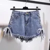 Kvinnors shorts kvinnor hög midja Tassel denim vintage snöflinga inelastiska korta jeans med knappar kvinnliga sommarbandage fickor