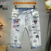 Męskie spodenki 2023 Designer dżinsy krótkie uliczne fiolet dla mężczyzn haftowe spodnie damskie gość zrytowany dżinsowy dżinsowy moda streetwearu szczupły