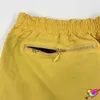 Pantalones cortos para hombres Pantalones cortos de agujas de nylon amarillo 2022 Hombres Mujeres 1/1 Pantalones cortos de agujas de alta calidad Bordado verde Mariposa Malla AWGE BreechesH24222