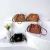 Zhaocai pengar kreativ dekoration nisch ny xiaoxiangfeng kvinnors one axel crossbody dragstring väska 75% fabrik direktförsäljning