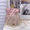 Famous socialite tassel pearl silk satin drawstring bucket heavy industry handmade woven beaded pearl carrying crossbody bag