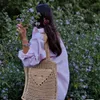 Luxury designer beach bag Single shoulder handbag Women's new hollowed-out hand-woven grass tote bag Fashion casual versatile large capacity shopping bag