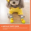 Dog Apparel 4 PCS PET FOOT COVER NON SOOCKSのためのスキッド靴下防止アンチスリップ素敵なノンスリップ