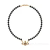 Collier Planet Collier de créateur pour femme Vivienen Bijoux de luxe Viviane Westwood Viviennes Collier en agate noire Saturne plein de diamants dans un style anglais pour femme D