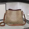 Borsa a tracolla a trama semplice di alta qualità di design di lusso Borsa a secchiello da donna Borsa a tracolla in pelle bovina di nuova moda Borsa per pendolari Borsa a mano