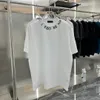 Summer Men Projektanci T-koszule luźne litery tee tee odzieżowe moda tops mans swobodne litera klatki piersiowej luksusowe szorty uliczne rękaw S-xxl