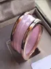 Koreansk keramisk man och kvinna rosa ring högkvalitativ lyx smyckesdesigner rostfritt stål 2020 Nytt gåva par ring hela PE4398079