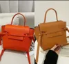 Ontwerper Echte lederen riem Koppelingszak Dames werk Tote Luxe Cross Body Classic Handtas Lady Witte Satchel Mens Purse Schouder Bags