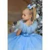 Ternos masculinos de luxo penas borla menina vestidos de natal céu azul lindo o-pescoço lantejoulas na altura do joelho festa pageant vestido de bola de casamento