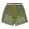 Designer Designer Shorts Rhude Shorts Mens Capsule Shorts Summer Beach Pants Mesh Material Andningsbar Svett Löst fitness basketbyxor Mens korta röda shorts Si