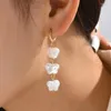 dangle earringsファッションシミュレートされた真珠蝶のための蝶rong gold color metal huggie韓国の宝石ギフト