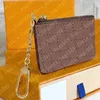 Com caixa laranja bolsa de chave de couro real famoso designer clássico feminino porta-chaves bolsa de moedas pequeno couro preto saco de bens