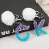 Keychains 1pc Pompom English Letter Keyring Purple Blue Color Harts Keychain with Puffer Ball 26 Words Handbag Charms