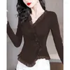 Kvinnors blusar eleganta knappar vikar rufsar asymmetriska kläder 2024 Autumn Winter Loose Korean Tops Princess Sleeve Shirts