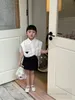 夏の子供の服セットインス女の子の三角形レースアップ半袖シャツベルトバッグスカート2pcsキッズカジュアル服S1103