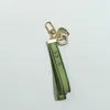 Designer keychain Luxury key chain bag charm female car key ring Pearl charm green ribbon delicate shells keychain couple pendant gift wholesale