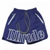 Designer Rhude Pantaloncini da uomo Athletic Casual Mesh Short Uomo Donna Alta qualità Classico Beach Fashion Designer di lusso Casual Street Hip Hop Pantaloncini Blu Verde e Rosso SX