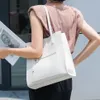 イブニングバッグジャパンシンプルなスタイルナッパレザーバケツ通勤トートバッグホワイトカウハイド女性ハンドバッグ品質