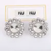 Designer Miuimiui Familys Nouvelles boucles d'oreilles sans oreilles pour femmes Imitation cristal Style de mode Fleur Boucles d'oreilles en diamant complet avec clips d'oreille de tournesol pour les femmes