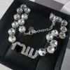 Créateur Miuimiui nouvelle famille Miao avec plein de diamants Miu lettres cristal féminité mode strass longues boucles d'oreilles