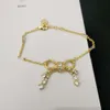 Designer Miuimiui Miao 22s Nouveau noeud papillon gland plein de boucles d'oreilles en diamant collier pour femme bracelet broche pleine de boucles d'oreilles haut de gamme et élégantes en zirconium