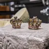 Boucles d'oreilles Stud Amorita boutique en or avec petite couronne.J240226