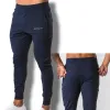 Calça de moletom 2023 nova fitness muscular que executa o treinamento esportivo de algodão calças de algodão masculino de feixe de feixe fino calças de saúde casuais