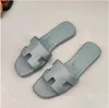 Zapatillas de diseñador Diapositivas Clásico Tacón plano Verano Moda perezosa Dibujos animados Cabeza grande Chanclas de goma Zapatillas de cuero Zapatos de mujer Sandalias sexy Grandes H8658