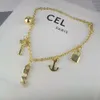 Designer Celline Saijia Nouvelle clé de verrouillage tête lettre collier femme bateau ancre petite boule d'or pendentif haute sens tempérament gland clavicule chaîne