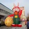 6 m 20 pieds de haut en gros personnalisé lapin de Pâques gonflable lapin décoration d'événement prix usine costume gonflable avec impression de logo gratuite pour la publicité du parc