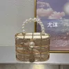 Sacs de soirée Hollow Metal Pearl Silk Satin Bird Cage Vegetable Panier de légumes pour banquet brillant et marin stupide transportant le crossbody 240227