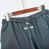 Pantalones cortos de diseñador para mujer, tela de nailon, material reflectante, pantalones informales de verano unisex para hombre