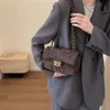 Textura popular corrente crossbody 2024 novo xiaoxiangjia bloqueio fivela ombro único portátil na moda bolsa feminina 75% fábrica atacado