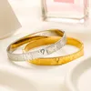 Bracelet de charme de luxe plaqué or bracelet de créateur en acier inoxydable printemps nouveaux cadeaux d'anniversaire d'amour bracelets conçus pour les femmes boutique bracelet avec boîte à bijoux