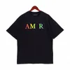 Amirs Mens Designer T Shirt Graphic Tee Tshirt ملابس رجال قمصان رسائل أزياء طباعة جولة أبيض أبيض أبيض قصير الأكمام للنساء ملابس كبيرة الحجم TEE TOP