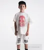 2024 Summer Boys Clown Lettre T-shirt imprimé NU Enfants T-shirts à manches courtes Mode Enfants Coton Casual Tops INS Enfant Trou Shorts S1115