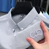 Chemises décontractées pour hommes Dyxue Light Luxury Coton Chemise de couleur unie Classique Broderie Designer Revers Business Top à manches longues M-4XL