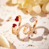 المصمم qeelin الصيني Zodiac Year Qilin فتح خاتم القرع المزدوج للإناث 18K Rose Gold White Fritillaria Red Chalcedony Index Finger Ring
