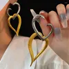 Orecchini pendenti Vintage bicolore in metallo cuore irregolare crossover forma cava gioielli personalità moda ragazze regali del partito 2024